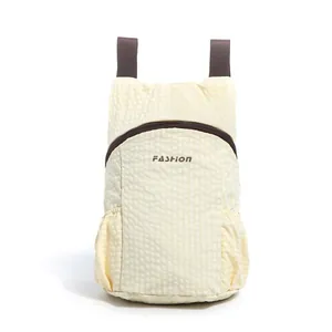 Lightweight foldable outdoor backpack with water-repellent fabric in cream yellow