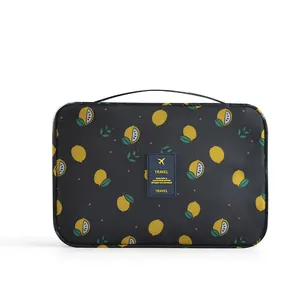 Large capacity travel toiletry bag with yellow lemon pattern on black background