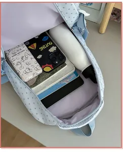 Detailed view of the large capacity interior of a light blue star pattern backpack