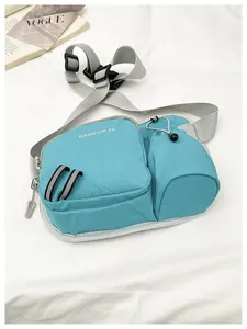 Detailed view of a light blue waterproof sports waist bag with water bottle pouch.