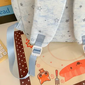 Detailed view of the light blue star pattern backpack with adjustable shoulder straps