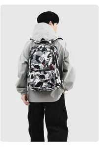 Back view of a man wearing a large capacity camouflage backpack in a grey jacket