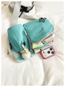 Small turquoise Korean style ins crossbody bag for women showing interior storage