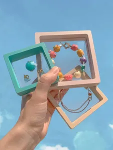 Detailed macro view of Macaron PE film suspension jewelry boxes in multiple colors
