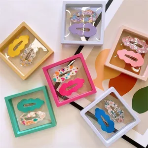 Detail view of colorful macaron floating jewelry boxes with transparent PE film