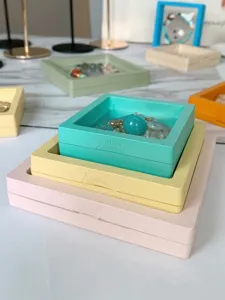 Three different sizes of macaron colored PE membrane floating jewelry shadow boxes.