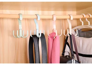 Close-up detail showing multi-functional rotating 4-claw hangers for belts and scarves