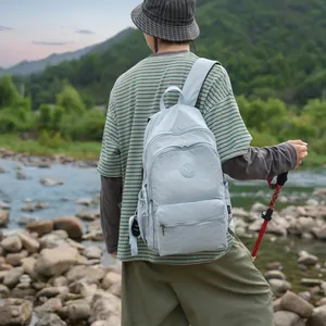 Outdoor lifestyle view of the light blue casual backpack for women during hiking