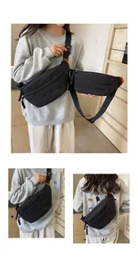Detailed view of black sporty crossbody waist bag with embroidered lettering and adjustable strap