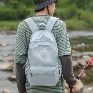 Modern light blue lightweight leisure backpack worn during a scenic outdoor hiking trip