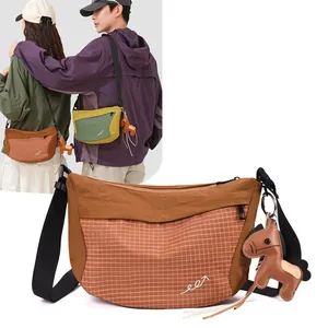 Fashionable lightweight nylon grid crossbody bag with horse charm for outdoor travel