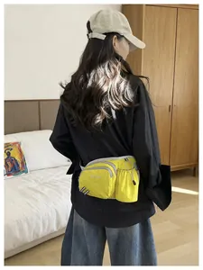 Rear view of a model wearing a bright yellow sports fanny pack with bottle holder