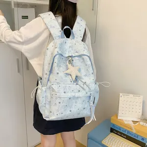 Fashionable light blue Korean style backpack with star pattern and plush star charm detail