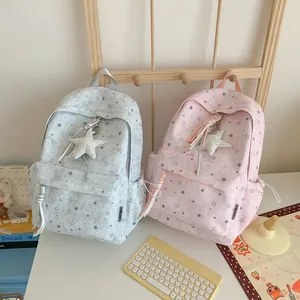 Two Korean style star-patterned backpacks in pink and blue with cute star charms