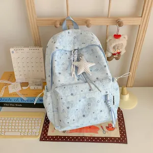 Aesthetic Korean ins style light blue backpack with white star patterns and cute star pendant