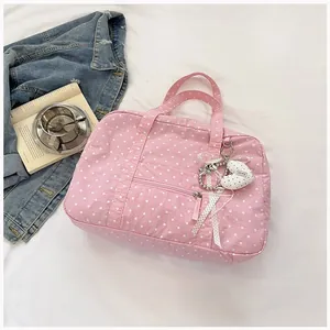 Pink polka dot Boston bag and travel tote with lovely heart pendant charms