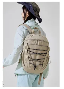 Professional back view of khaki outdoor hiking backpack with unique bungee cord strap design