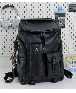 Detailed view of vintage black leather backpack with multiple pockets for commuting