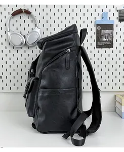 Side view of a black retro faux leather backpack for men with large capacity.