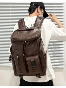Close-up of a vintage brown leather backpack worn by a male model for commuting
