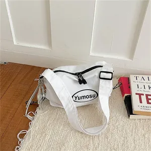 Lightweight stylish white shoulder bag with unique tassel and rope detail