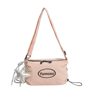 Stylish lightweight pink crossbody shoulder bag featuring a silver star charm and Korean design