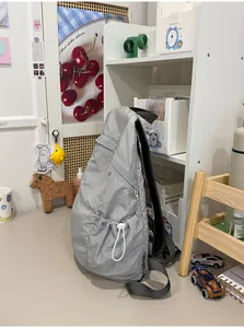 Lightweight gray minimalist nylon backpack for commuting in a desk setting