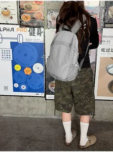 Back view of a lightweight gray backpack ideal for student travel and daily commute