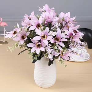 Detailed view of 10-head artificial purple daisy bunch in a white textured vase