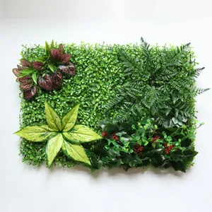 Gedetailleerde weergave kunstplantenwand met gemengd gebladerte en groen gazon voor wanddecoratie