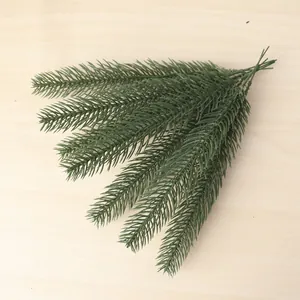 Detailed texture of dark green artificial pine branches for DIY Christmas decor