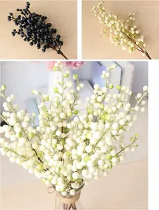 Detailed close-up of artificial 5-prong berry branches in white and navy blue colors.