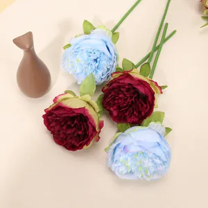 Close-up of artificial peony stems with detailed burgundy and light blue silk petals