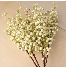 Detailed macro view of artificial white foam berry branches for elegant floral home decoration