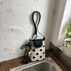 Stylish polka dot canvas crossbody bag, casual bucket phone bag with leather strap and flap.