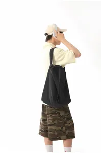 Spacious black nylon tote bag for gym and sports, durable and minimalist travel bag