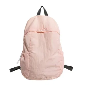 Minimalist light pink lightweight sports backpack with black straps for students and travel