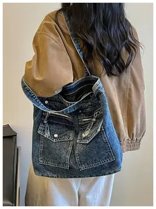 Large capacity vintage denim tote bag with functional pockets for women's daily commute.