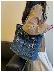 Casual denim tote bag for women featuring large capacity and stylish pocket details