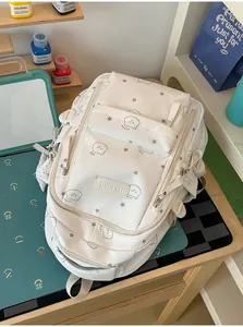 Mochila escolar blanca de gran capacidad con estrellas y osos para niñas.