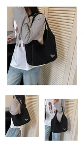 Three views of a casual black denim shoulder tote bag featuring dog embroidery
