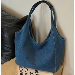 Vintage denim tote bag with large capacity and black handles for casual commuting