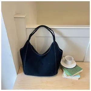 Retro black denim tote bag with white stitching, large capacity shoulder bag for commuting.