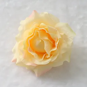Detailed top view of a cream silk rose head with soft pink petal edges for wedding decor