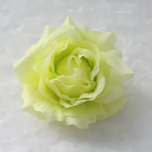 Macro view of a pale yellow silk rose flower head for wedding decoration arrangements