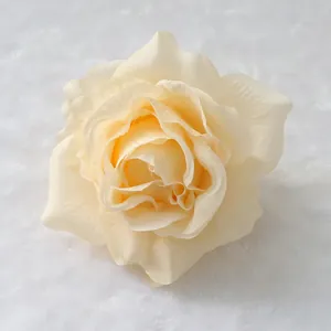 Close-up of elegant cream silk artificial rose head for wedding decoration arrangements