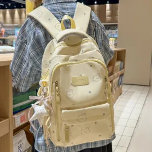 Mochila escolar amarillo crema para niñas con lindos osos y motivos de estrellas