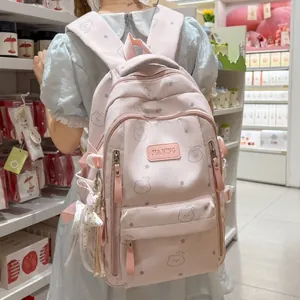 Linda mochila escolar rosa para niñas con patrón de oso y colgante de estrella moda.