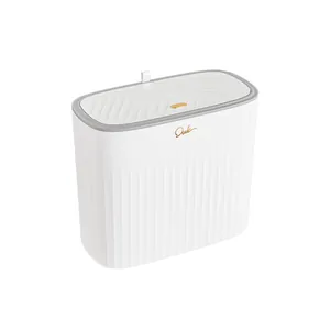 Minimalist white slim trash can with a textured lid designed for narrow spaces