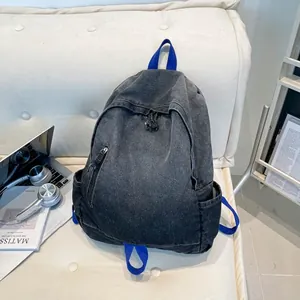 Vintage washed denim backpack with blue straps, large capacity for school and travel
